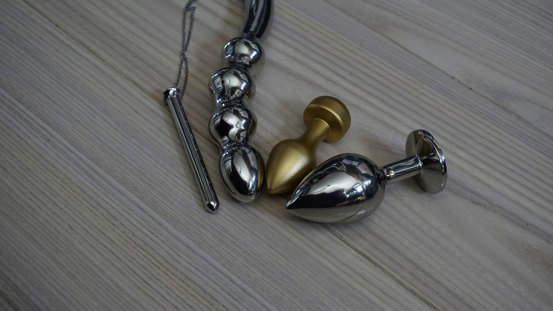 A collection of stainless steel butt plugs