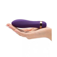 Rocks Off Twister vibrator in purple held in a hand, featuring a sleek design and gold accent.