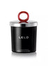 Lelo black pepper and pomegranate massage candle in a black container with a silver lid and red handle.