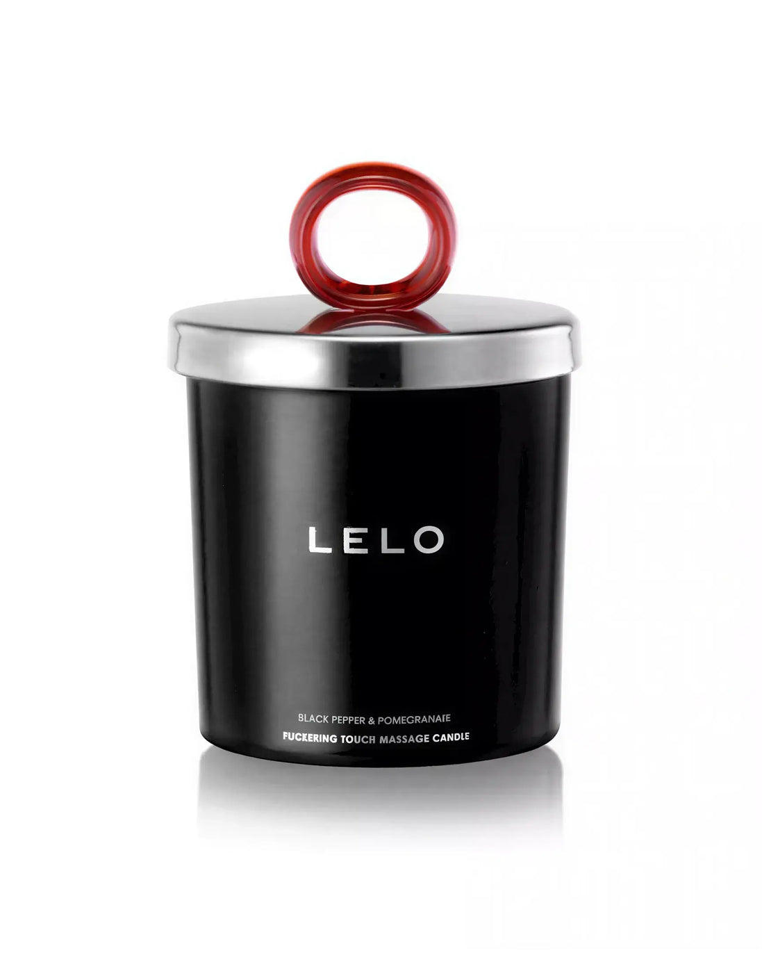Lelo black pepper and pomegranate massage candle in a black container with a silver lid and red handle.