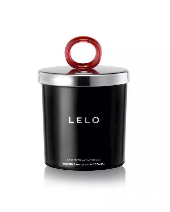 Lelo black pepper and pomegranate massage candle in a black container with a silver lid and red handle.
