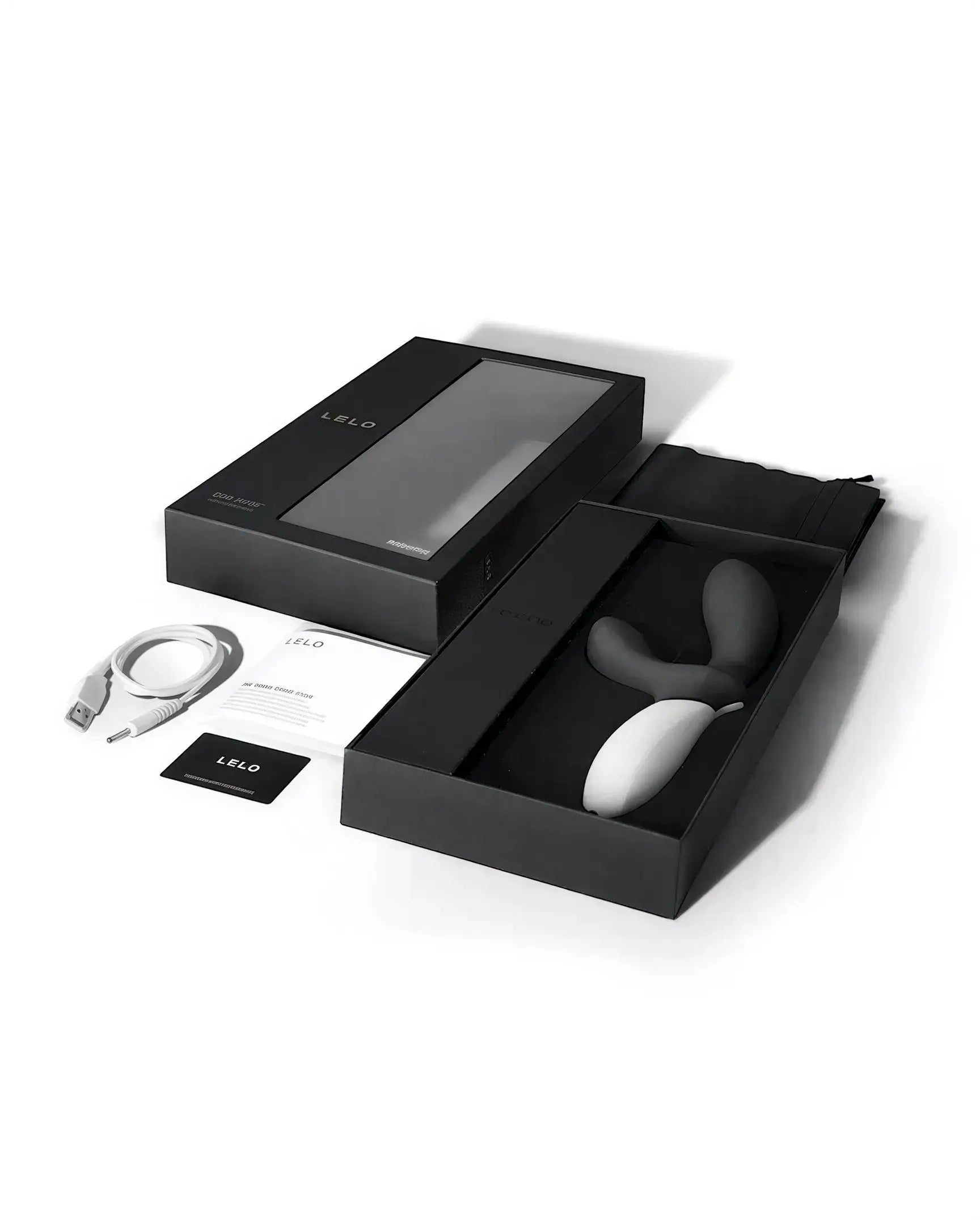 Lelo Loki Wave prostate stimulator in a black box with accessories, including a charging cable and user guide.