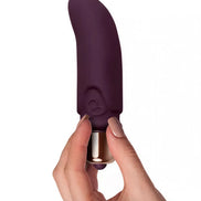 Purple Rocks Off Dalia vibrator held in a hand, featuring a smooth silicone texture and curved design.