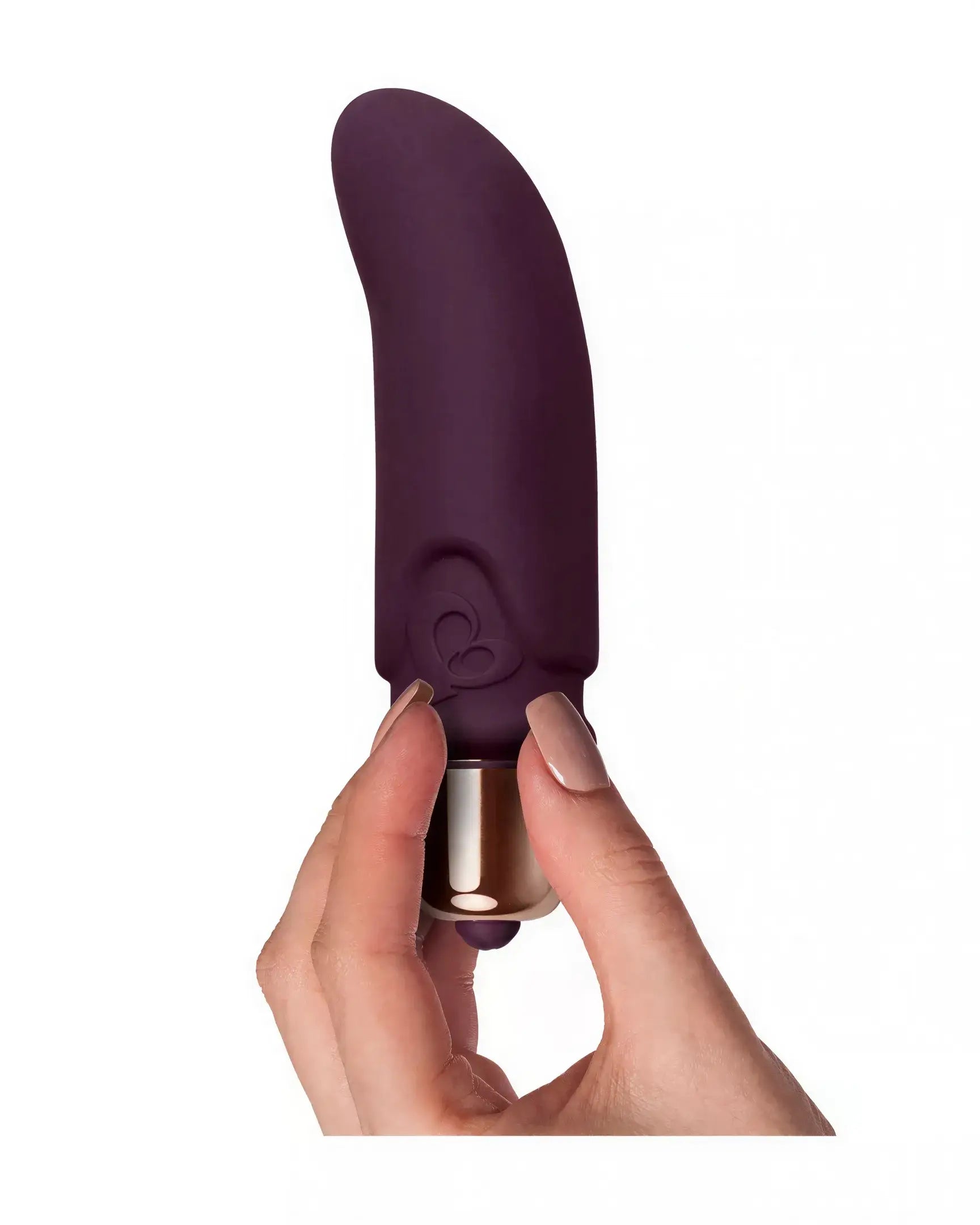 Purple Rocks Off Dalia vibrator held in a hand, featuring a smooth silicone texture and curved design.