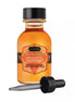 Kama Sutra Oil of Love kissable body oil in tropical mango, 22ml bottle with a dropper cap.