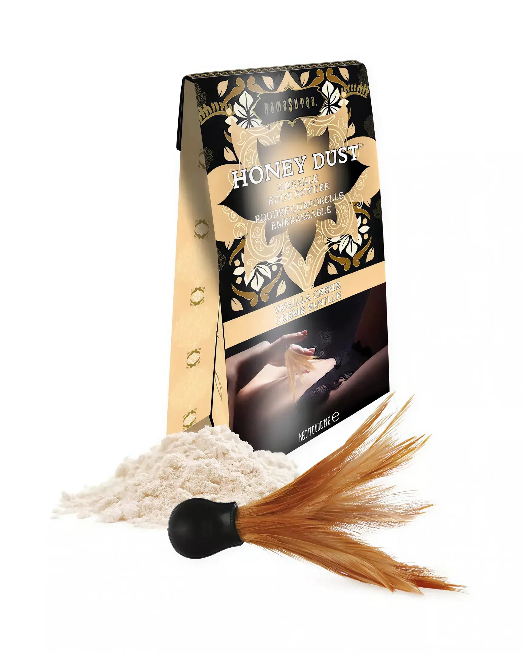 Kama Sutra Honey Dust kissable body powder in Vanilla Crème with a feather applicator and powder spilling from the box.