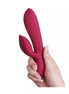 Rocks Off Every Girl vibrator in a deep pink color, held in a hand, featuring a curved design and textured surface in a hand.