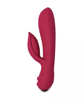 Rocks Off Every Girl vibrator in a deep pink color, held in a hand, featuring a curved design and textured surface.