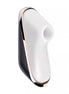 Satisfyer Pro Traveler in white and black with rose gold accents, featuring a curved design and control buttons.