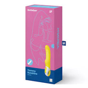 Satisfyer Vibes Yummy Sunshine vibrator in a yellow color, displayed in a pink and blue packaging box.