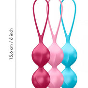 Satisfyer V Balls in pink, blue, and red, each with a loop for easy handling, measuring 15.6 cm in length.
