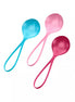 Satisfyer strengthening balls in blue, pink, and red colors with ergonomic handles for easy grip.