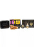 Kama Sutra Weekender Kit featuring coconut pineapple massage oil, sensual cards, and a feather tickler in a black tin.