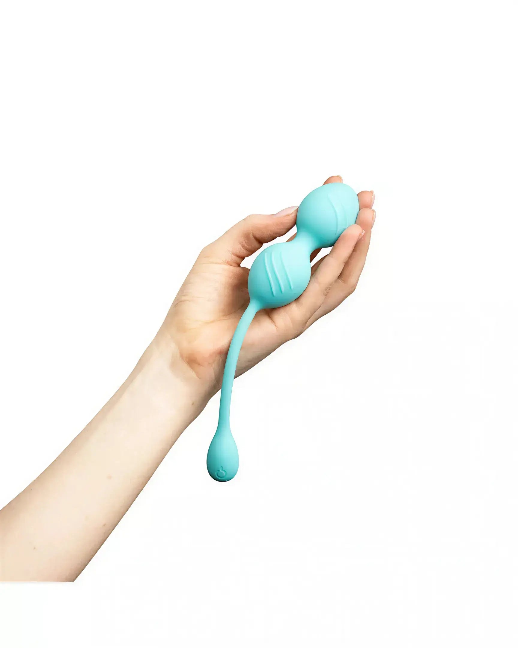 Rechargeable vibrating Kegel ball held in a hand, featuring a smooth turquoise design and a flexible tail.