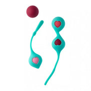 Clio Kegel balls in teal with heart cutouts, featuring a red ball and a flexible retrieval string.