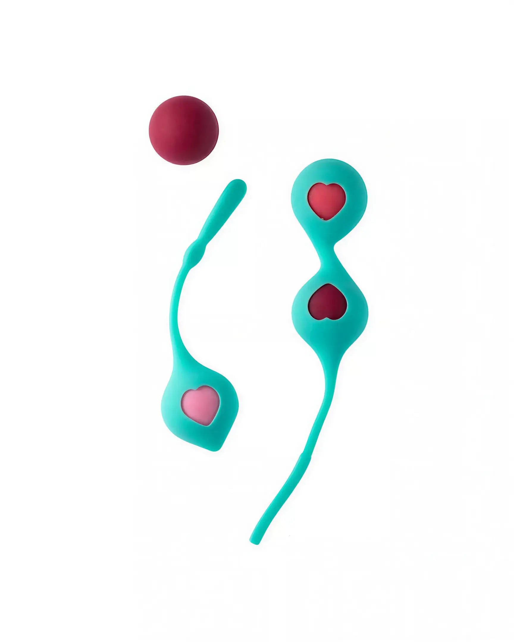 Clio Kegel balls in teal with heart cutouts, featuring a red ball and a flexible retrieval string.