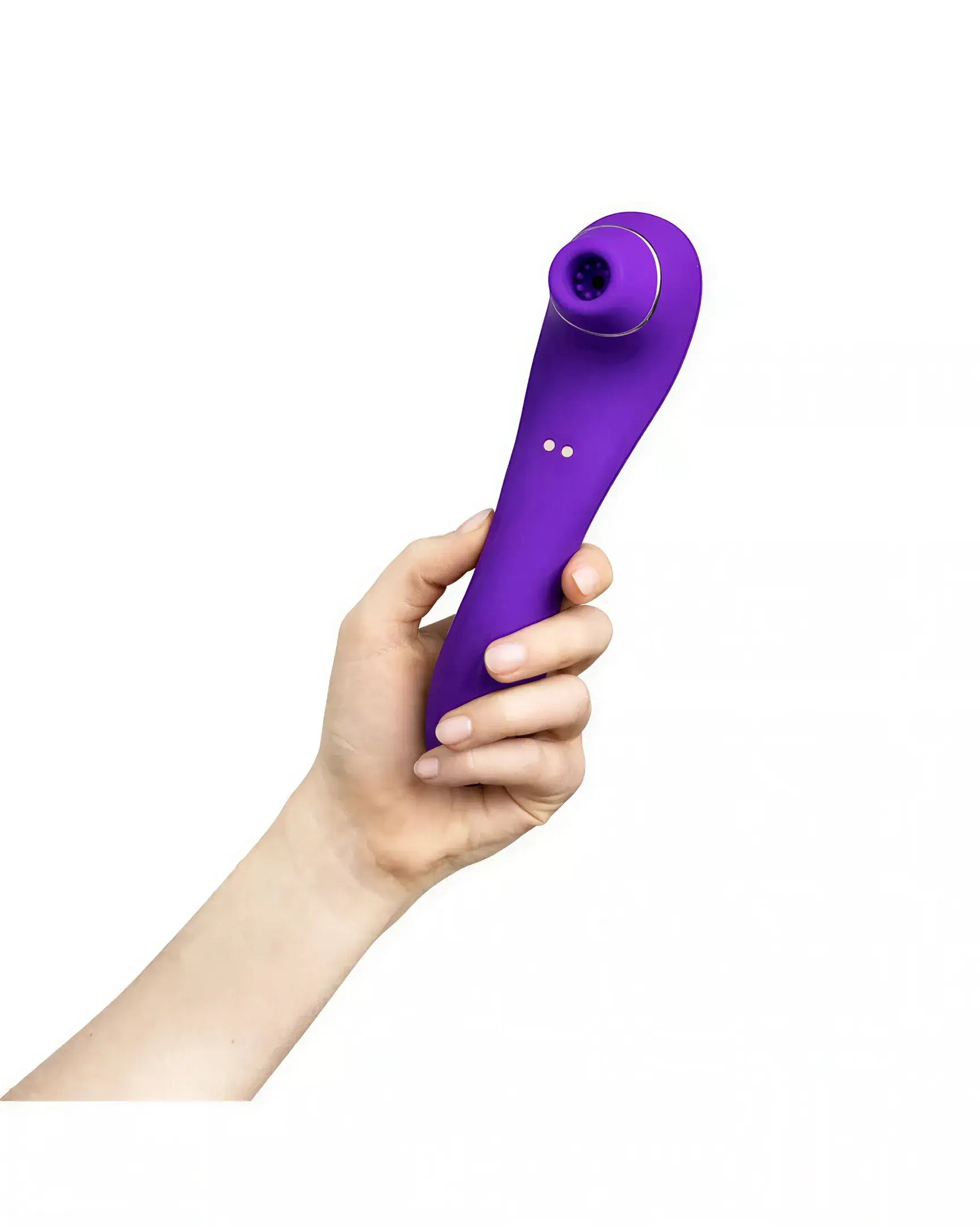 Purple Calla sucking vibrator held in a hand, featuring a curved design and a suction tip.