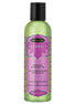 Kama Sutra Naturals Island Passion Berry massage oil in a 59ml green bottle with purple label and floral design.