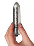 Rocks Off Frosted Fleurs bullet vibrator held in a hand, featuring a shiny silver finish and tapered design.