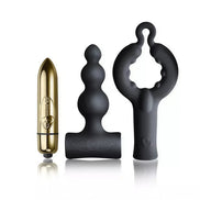 Rocks Off Silhouette Dark Desires Be Mine Kit featuring a gold bullet vibrator, black silicone anal plug, and a textured r...