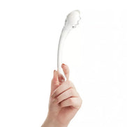 Lucent Luna curved glass massager held in a hand, featuring a smooth, transparent design with a rounded tip.