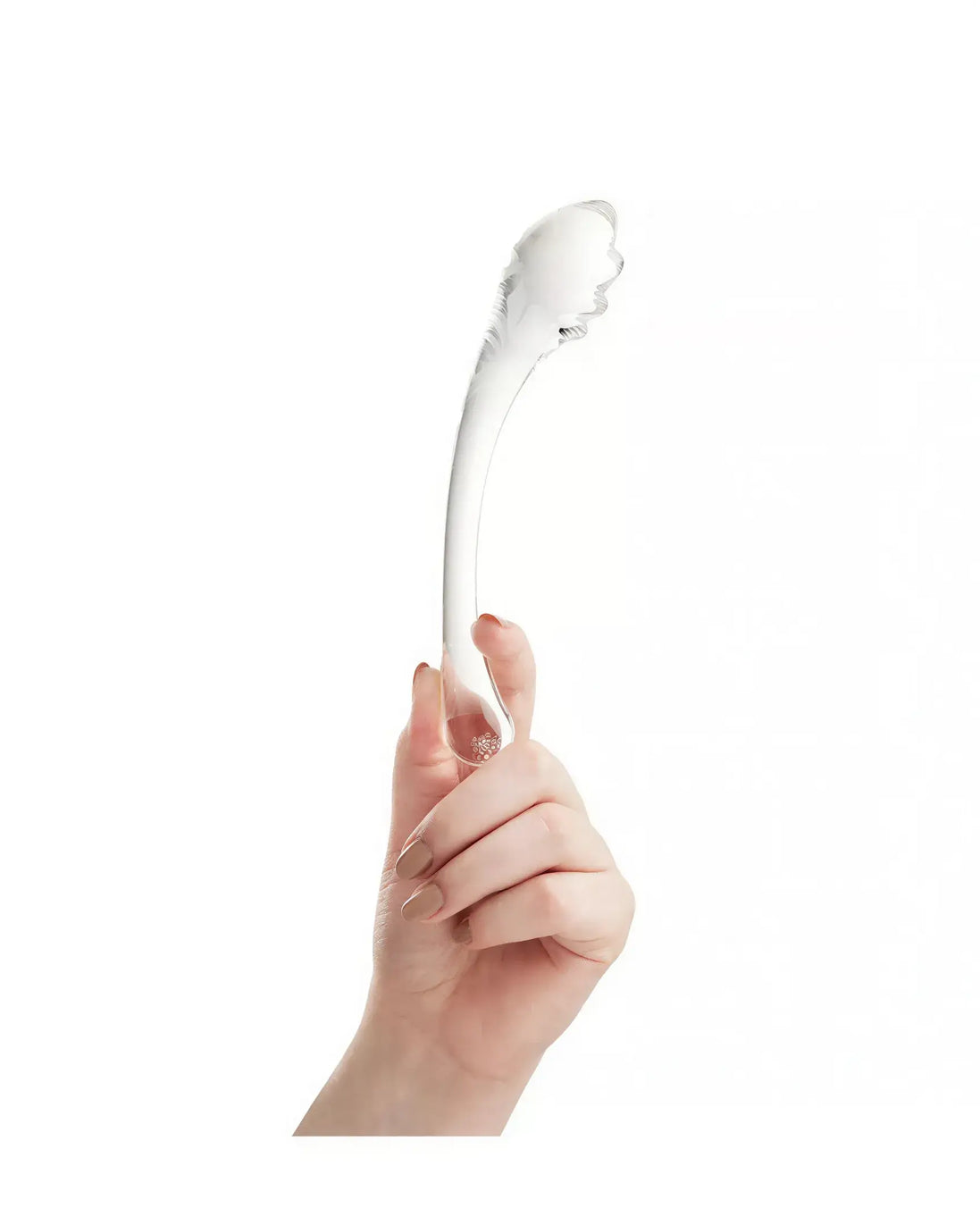 Lucent Luna curved glass massager held in a hand, featuring a smooth, transparent design with a rounded tip.