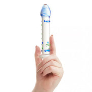 Lucent Hydra glass massager held in a hand, featuring a clear body with blue and green accents.
