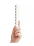 Lucent Bubbles glass massager held by a hand, featuring a series of smooth, round bubbles along its length.