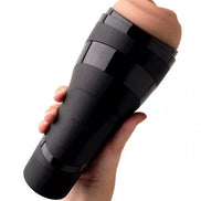 Satisfyer Men Classic in black with a realistic skin-like top, held in a hand against a white background.