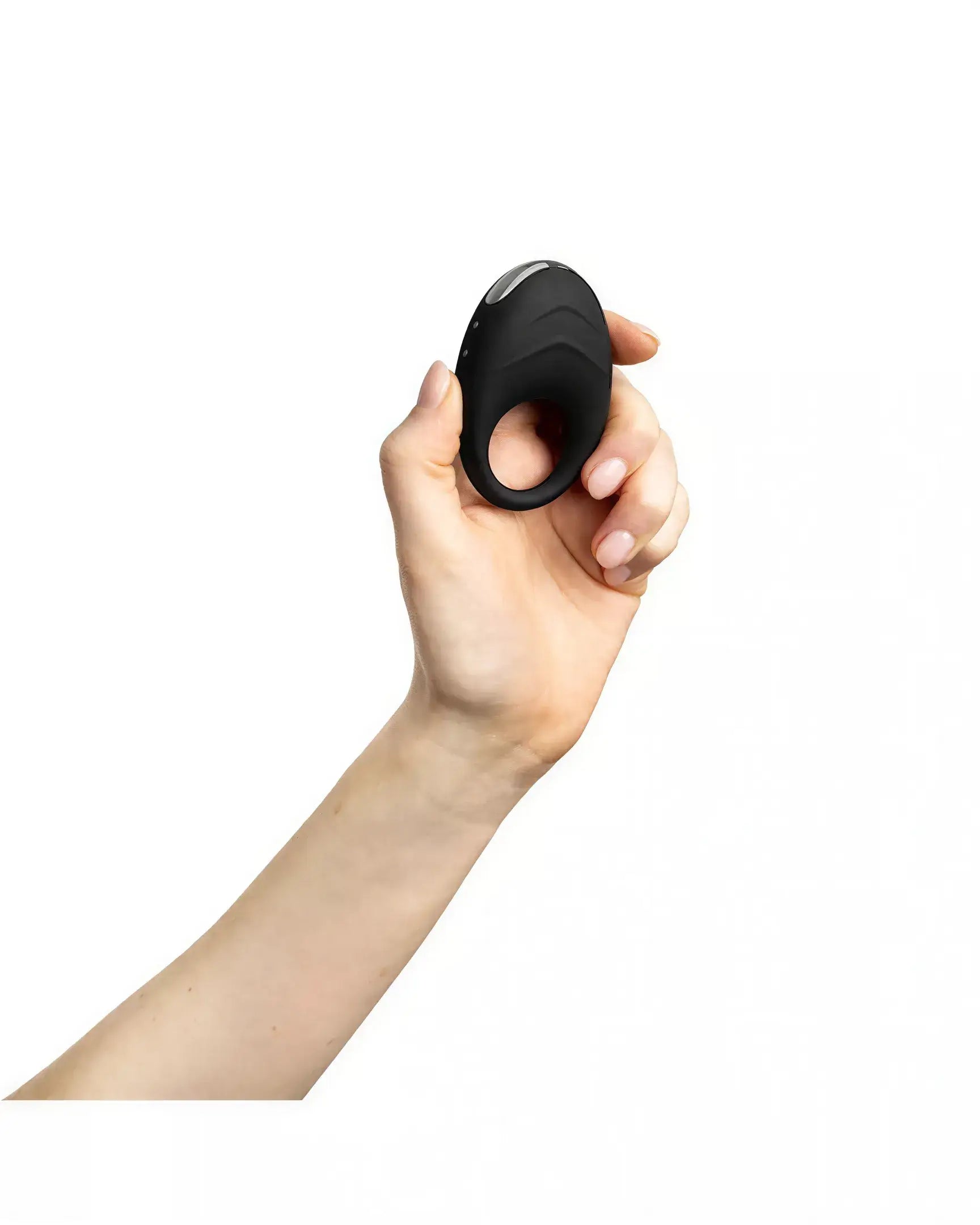 Black vibrating cock ring held in a hand, featuring a smooth surface and ergonomic design.