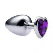 Alloy love heart gemmed butt plug with a shiny silver finish and a purple heart-shaped gem at the base, measuring 3.7 inches.