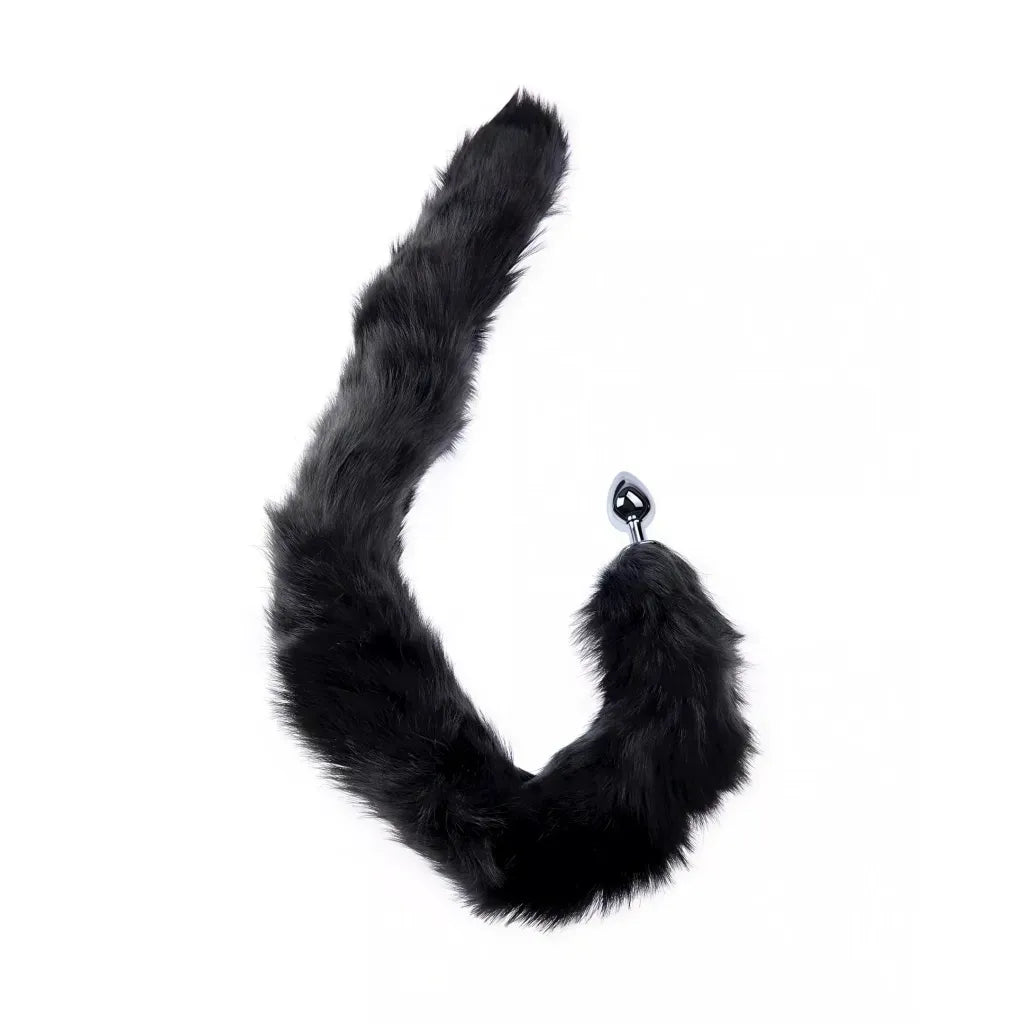Black furry tail accessory with an anal plug on a white background