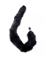 Black furry tail accessory with an anal plug on a white background
