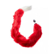 Red furry tail with a white tip with an anal plug on a white background
