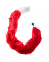 Red furry tail with a white tip with an anal plug on a white background
