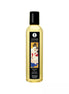 Shunga Massage Oil Island Blossoms in a clear bottle with a black cap and decorative label featuring a couple.