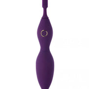 Purple Tanda clitoral vibrator with textured tip and power button, featuring a sleek, ergonomic design.