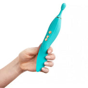Thana clitoral vibrator in teal held by a hand, featuring a textured tip and control buttons.