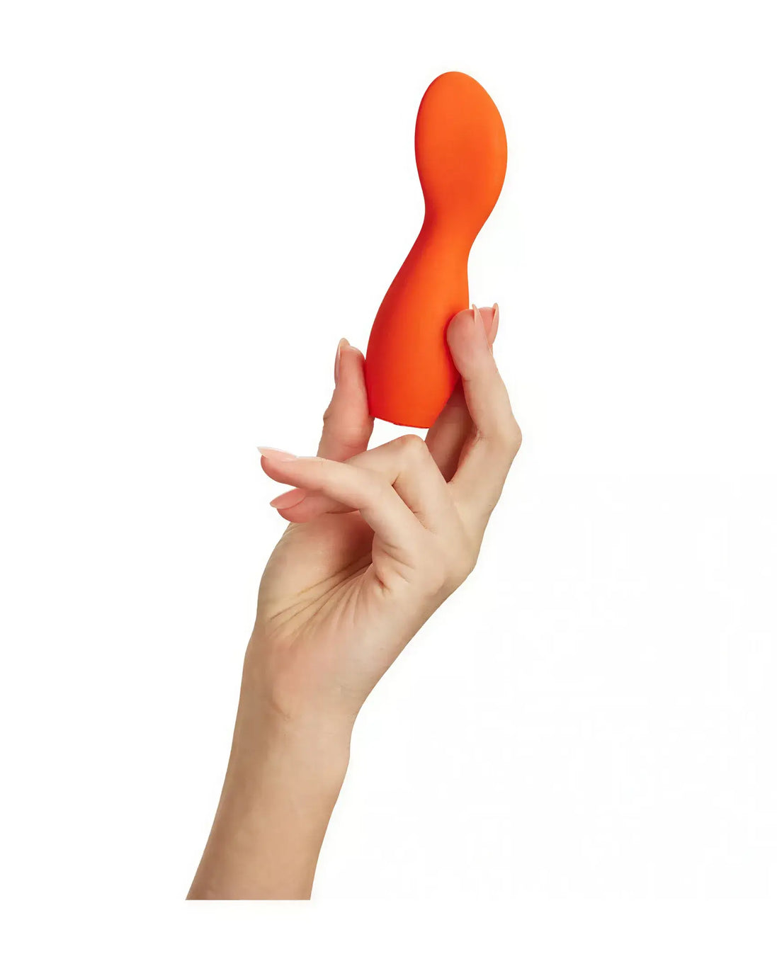 Cato paddle vibrator in bright orange held by a hand, showcasing its ergonomic shape and smooth surface.
