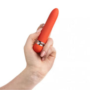 Share Satisfaction Cais Mini Vibe held in a hand, featuring a smooth, orange silicone body and silver accents.