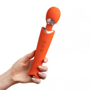 Zarina luxury wand vibrator in orange, held by a hand, featuring a smooth silicone body and control buttons.