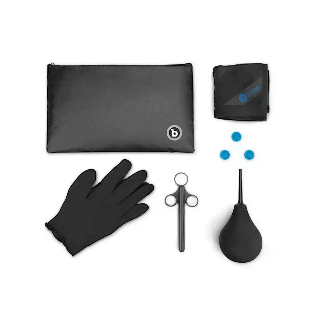 B-Vibe anal massage and education set with black gloves, bulb syringe, scissors, and storage pouch.