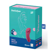 Satisfyer Sexy Secret panty vibrator in a teal box with pink accents and line art design, featuring Bluetooth connectivity.