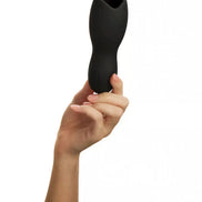 Black Jina Head Exciter held in a hand, featuring a curved design and textured surface for enhanced grip.