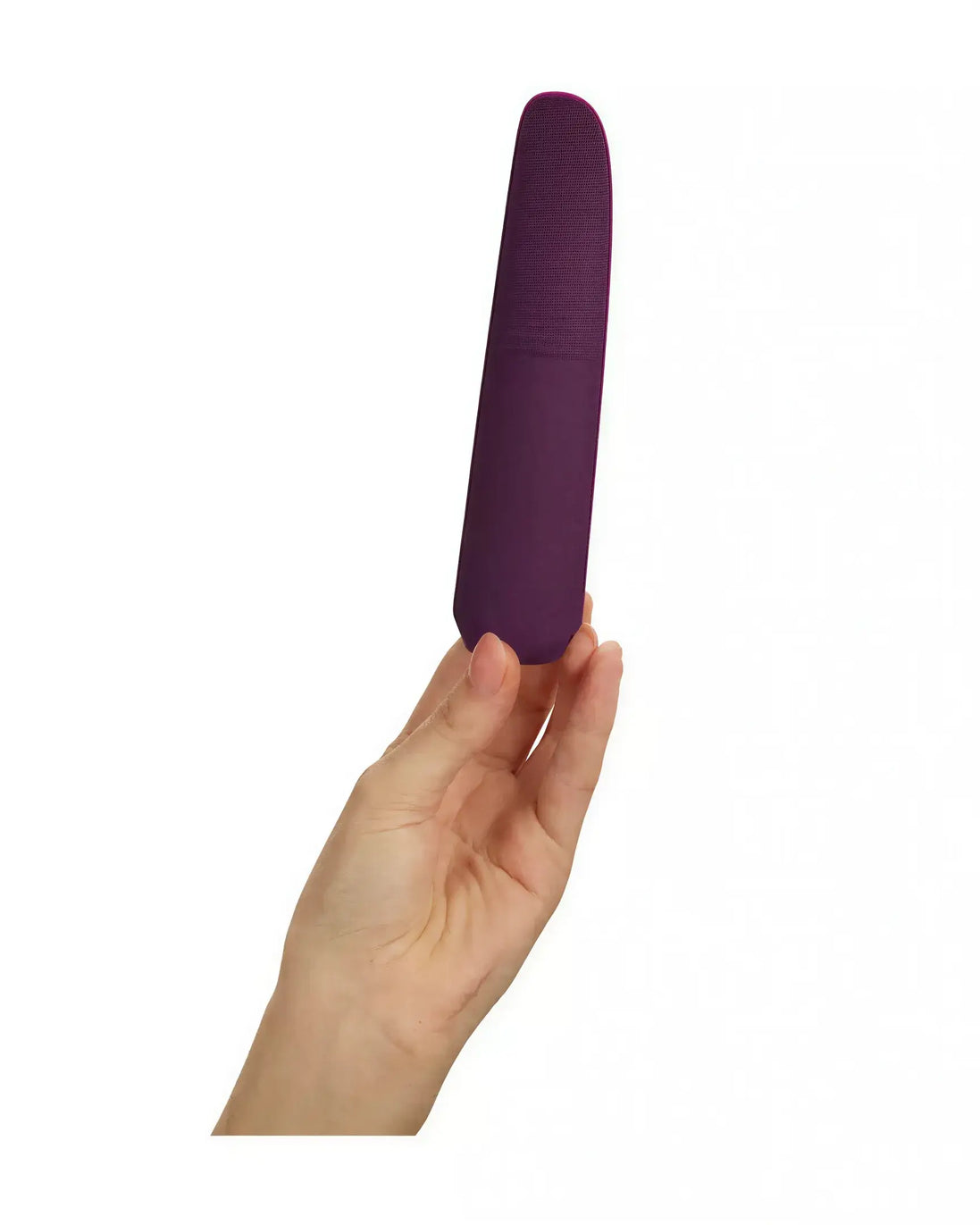 Hand holding a purple silicone vibrator with a textured grip and sleek design.