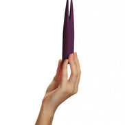 Share Satisfaction Deux in a deep purple color, held in a hand, featuring a sleek, elongated design with pointed ends.