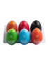 Set of six colorful masturbator eggs in a tray, featuring green, blue, orange, red, black, and purple designs.
