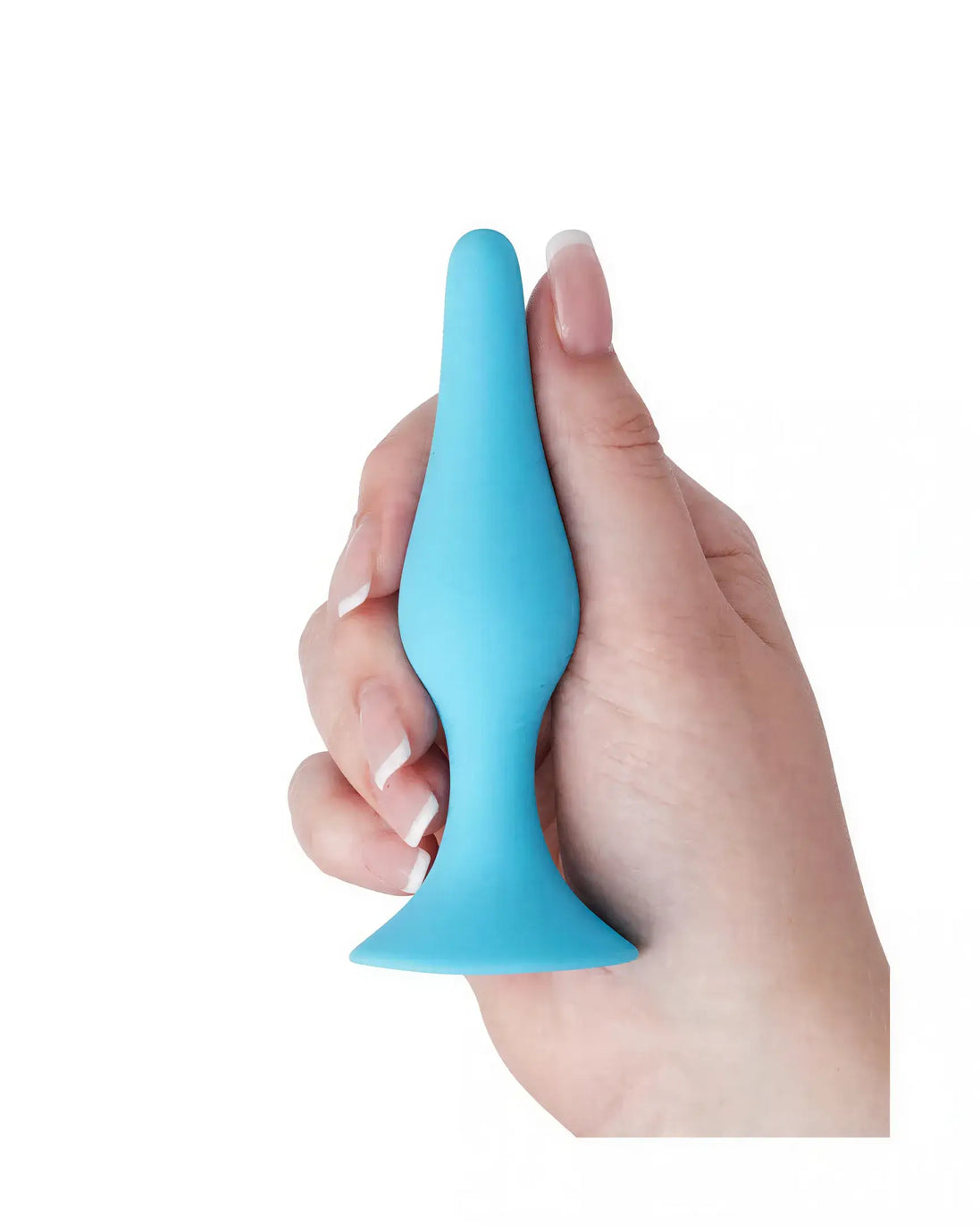 Medium silicone butt plug in blue held by a hand, featuring a tapered tip and flared base for safety.