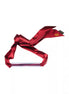 Luxury bar gag with a shiny silver bar and a deep red satin ribbon tied in a bow.