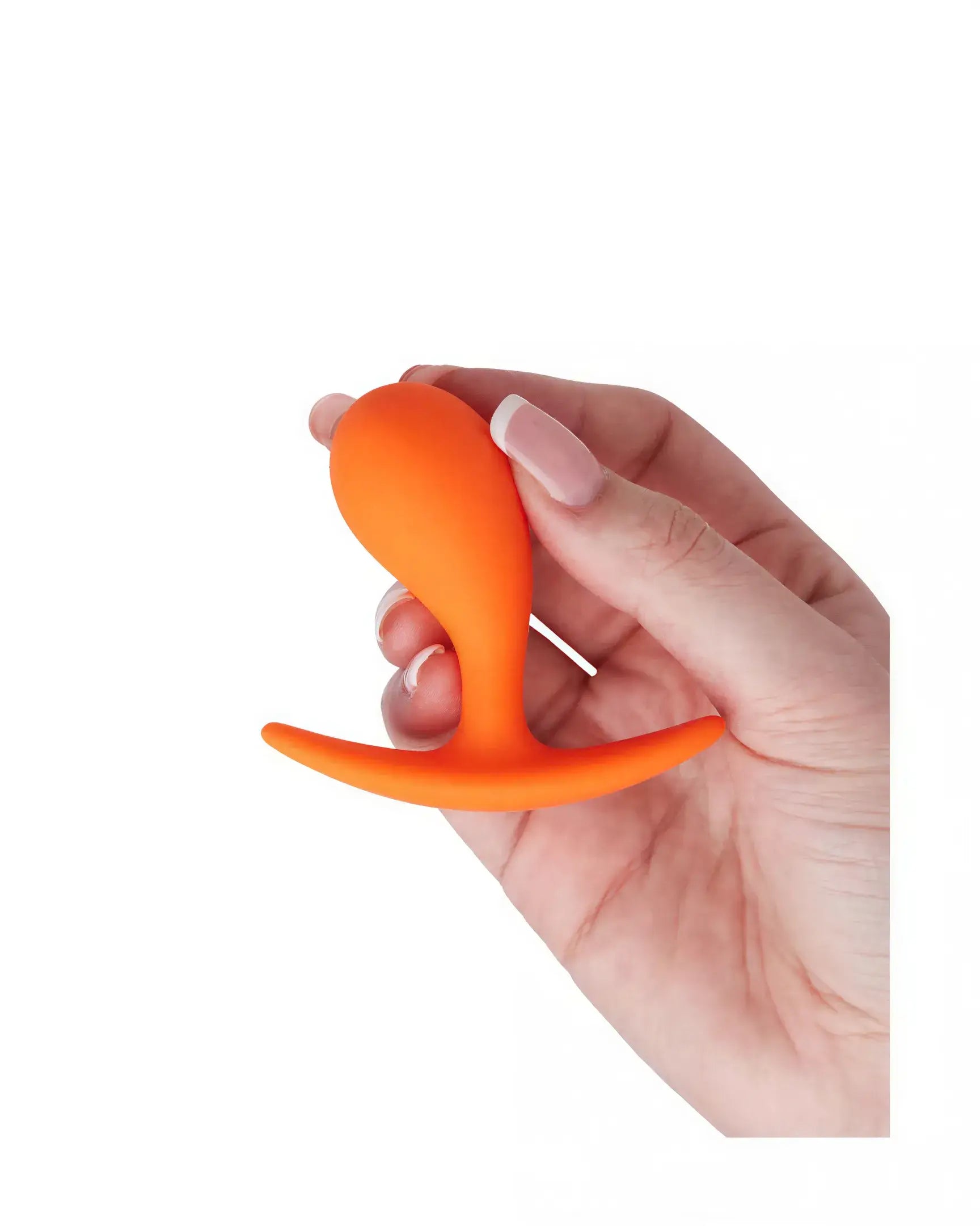 Medium curved plug in bright orange held in a hand, featuring a tapered tip and a flared base for safety.
